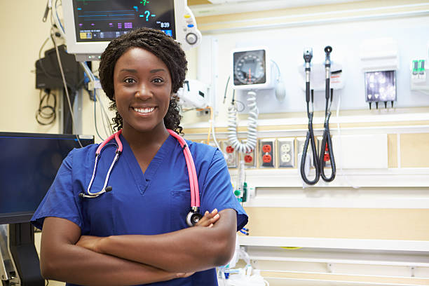 portrait of female nurse in emergency room smiling at camera